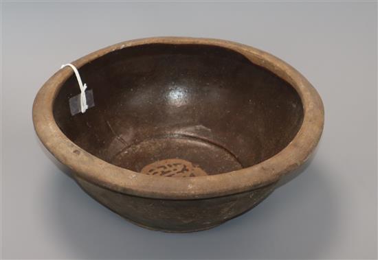 An Indonesian stoneware pottery bowl diameter 30cm